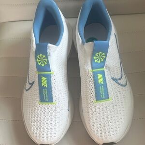 Nike woman’s white  and Blue Sneakers 7.5 M NWOT